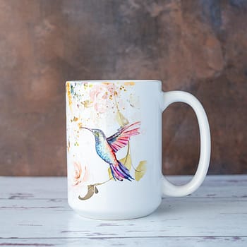 Left Side View of the Hummingbird Mug by Florae & Snow against a rustic background