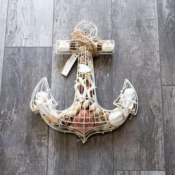 Ivory coastal anchor potpourri by Andaluca on a wood background